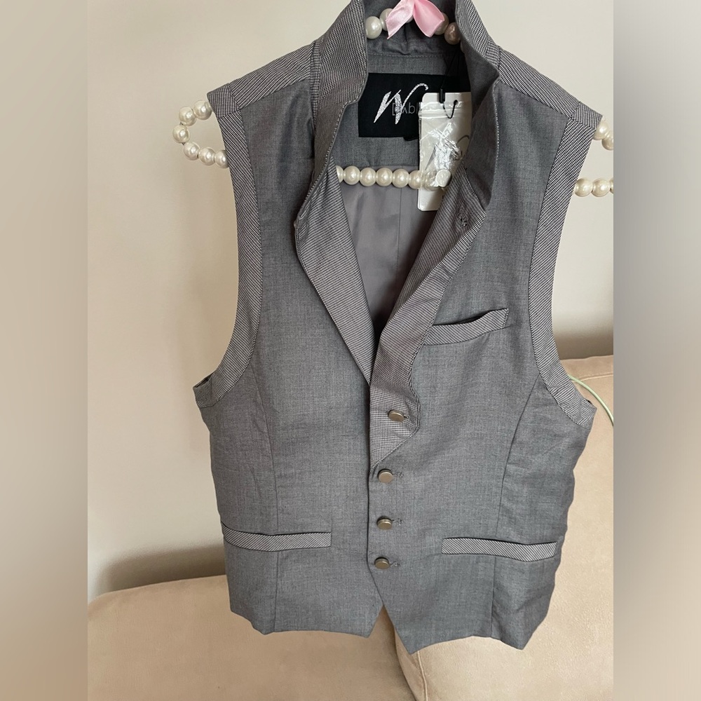 Silver / gray vest . Medium / large size . Brand new